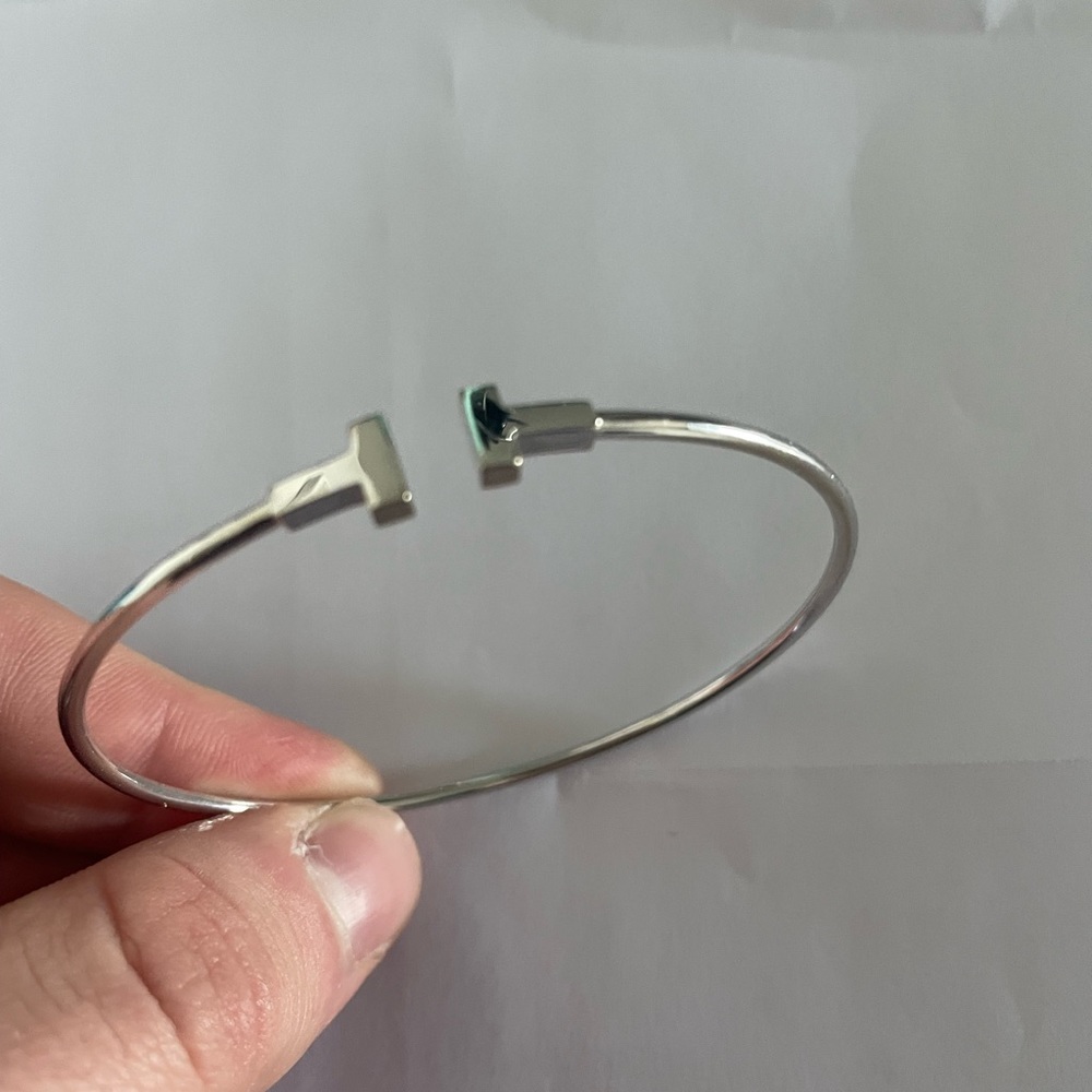Barely worn, does not fit and could not return. Tiffany T bracelet with box.